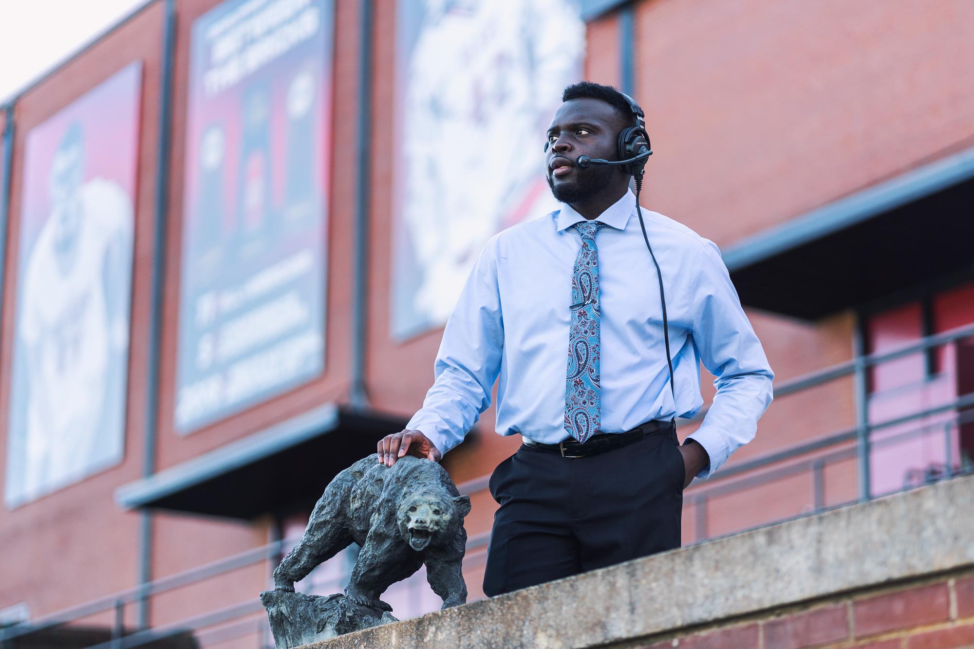 Ande served as a graduate assistant at Lenoir-Rhyne College and posed for the photo before graduation.